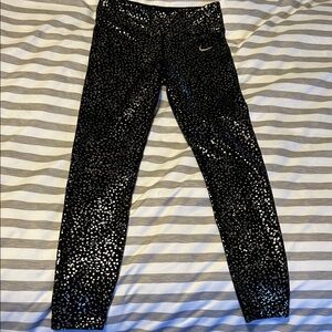 Nike Women's Black and Gold Star Leggings